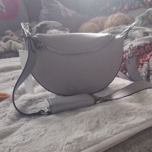 Elegant Black Crossbody Bag with Adjustable Strap and Sleek Design